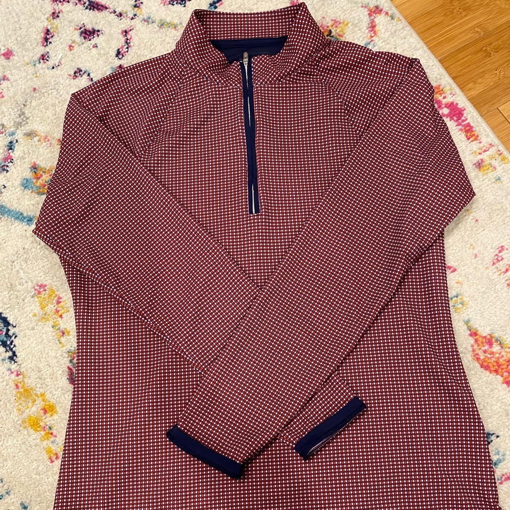 Women’s Peter Millar quarter zip.